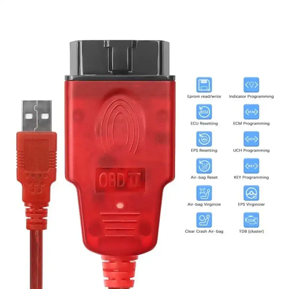 Renolink diagnostic cable أمام سيارة Dacia Duster في ورشة صيانة، يستخدم لتشخيص وبرمجة الأنظمة الإلكترونية